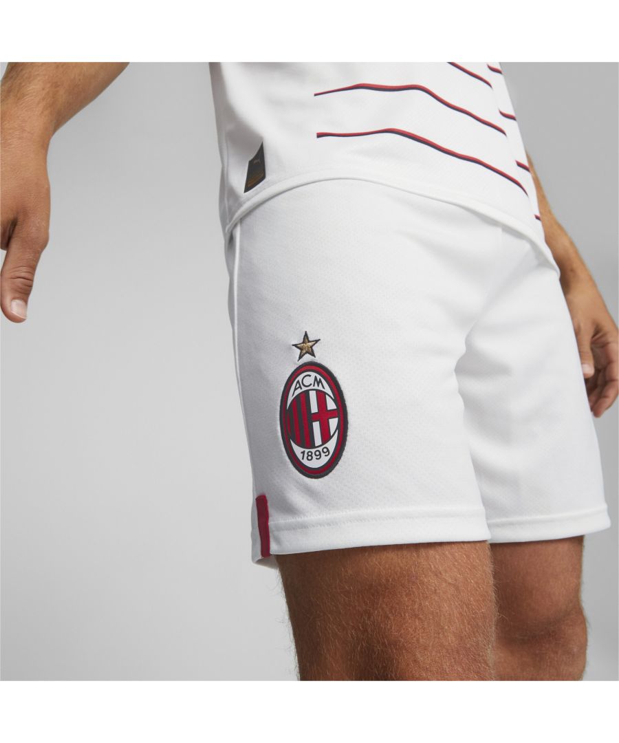 PRODUCT STORY Show up to the San Siro looking, and playing, like A.C. Milan’s star player with these replica shorts. They’re made from sweat-wicking material, to keep you cool in the tensest moments of the game, and finished with the Rossoneri’s famous crest on the leg. FEATURES & BENEFITS : dryCELL: Performance technology designed to wick moisture from the body and keep you free of sweat during exercise Recycled Content: Made with at least 20% recycled material as a step toward a better future DETAILS : Regular fit Elasticated waist Twin needle hem PUMA Cat Logo on the leg Official team crest on the leg