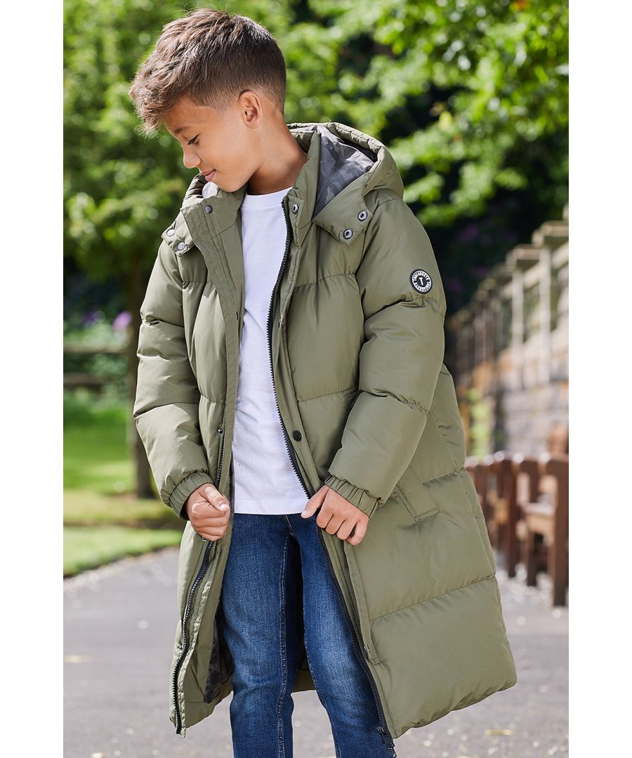 This longline hooded, padded jacket from Threadboys features a two-way zip and popper fastenings. The jacket also has two side pockets, elasticated cuffs, and branded badge on the sleeve. Perfect for keeping warm this back-to-school season, other colours and styles are also available.