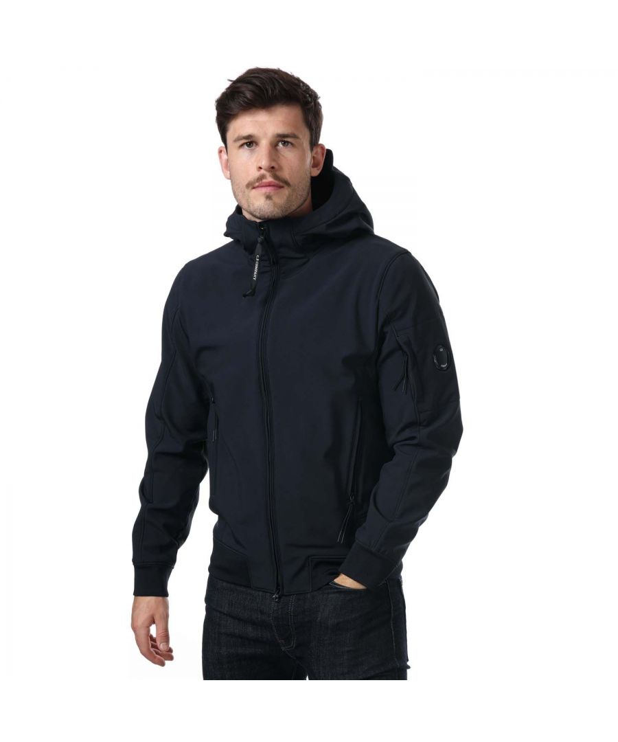 Mens C.P. Company Shell- R Jacket in navy.- Adjustable hood.- 2 side zipped pockets.- Ribbed cuffs.- C.P. Company sleeve lens and arm pocket.- Regular fit.- 94% Polyester  6% Elastane.- Ref: 13CMOW003A888