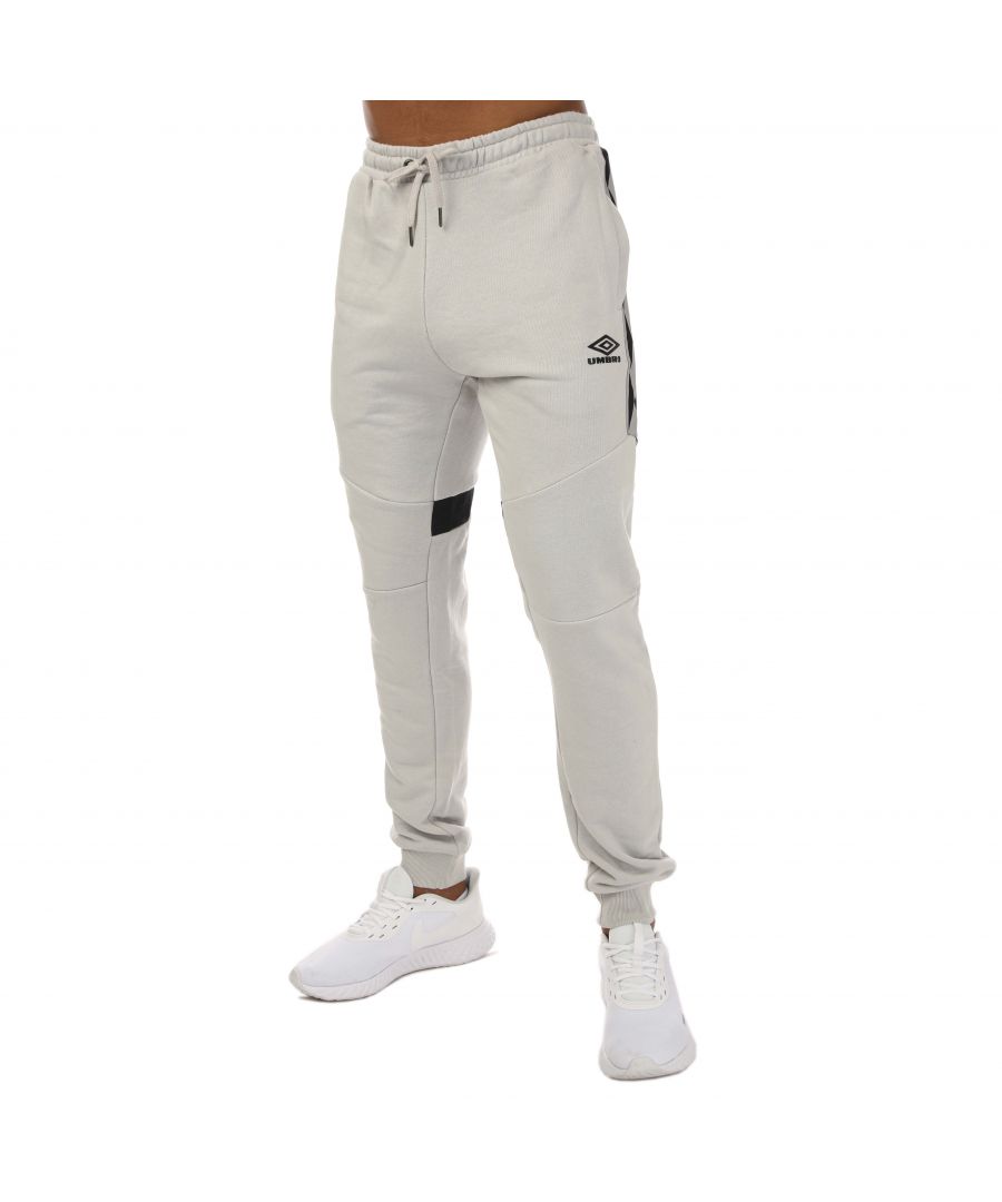 Mens Umbro Diamond Taped Jog Pants in grey.- Adjustable waistband.- Side pockets.- Umbro logo in a raised print to the front leg.- Ribbed cuffs.- Regular fit.- 70% Cotton  30% Polyester.- Ref: UMJM0642NRVGRY