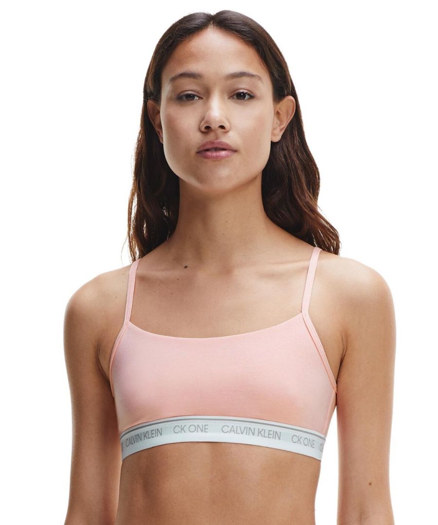 The CK One Cotton collection by Calvin Klein offers a timeless sports-luxe style in comfortable lingerie and sleepwear designs. This unlined string bralette has an easy pull-on design with a classic rounded neckline for a minimal sporty look. The iconic Calvin Klein underband adds a designer finish to this classic athlesiure style. A non-padded and unlined design allows for comfortable all-day and all-night wear. For a casual-cool coordinated look, wear with matching lingerie from the CK One Cotton range by Calvin Klein.\n\nSignature logo underband\nSports-luxe style\nRounded neckline\nAdjuatable string straps\nEasy pull-on design\nUnlined and non-padded\nComposition: 55% Cotton | 37% Modal | 8% Elastane\nListed in UK sizes
