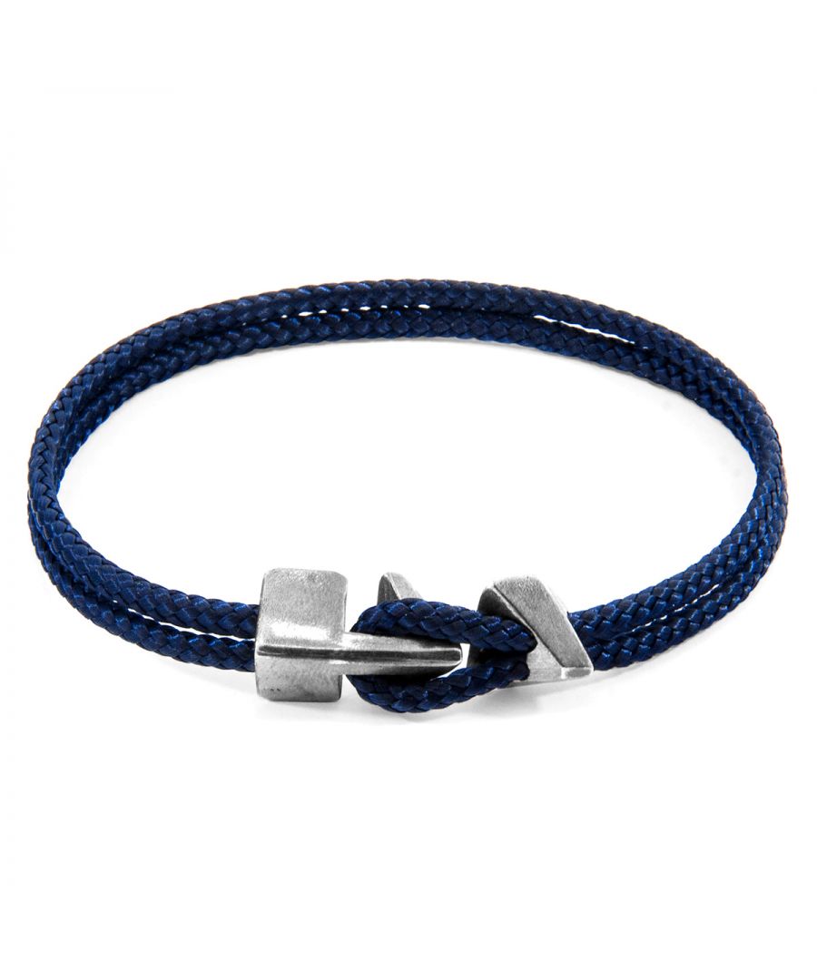The Navy Blue Brixham Silver and Rope Bracelet was both designed and skilfully handcrafted completely in Great Britain, In Quality We Trust. For the Modern Journeyman (and woman), ANCHOR & CREW takes ownership of an exploratory lifestyle and enjoys the Happy-Good Life. Combining British craft manufacturing with a discerning modern-minimalist style, this ANCHOR & CREW bracelet features:\n\n3mm diameter performance Marine Grade polyester and nylon rope (GB) \nSecure solid .925 sterling silver facetted arrow-shaped clasp and matching angled clamp (GB) \nSIZING\nThis bracelet is available in four bracelet lengths, 17cm, 19cm, 21cm or 23cm in circumference. To take the bracelet on or off your wrist, simply (un)hook the loop from beneath the arrow-shaped clasp and slide the matching angled clamp for added security.