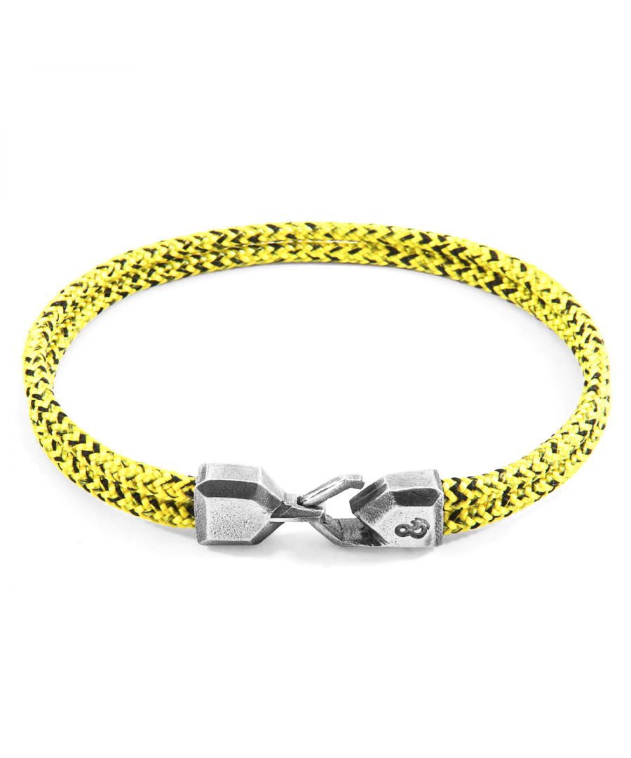 The Yellow Noir Cromer Silver and Rope Bracelet was both designed and skilfully handcrafted completely in Great Britain, In Quality We Trust. For the Modern Journeyman (and woman), ANCHOR & CREW takes ownership of an exploratory lifestyle and enjoys the Happy-Good Life. Combining British craft manufacturing with a discerning modern-minimalist style, this ANCHOR & CREW bracelet features: \n\n3mm diameter performance Marine Grade polyester and nylon rope (GB) \nSecure solid .925 sterling silver facetted lantern clasp and hook (GB)\n\nSIZING\nThis bracelet is available in four bracelet lengths, 17cm, 19cm, 21cm or 23cm in circumference. To take the bracelet on or off your wrist, simply slot the hook into the facetted lantern clasp and secure.
