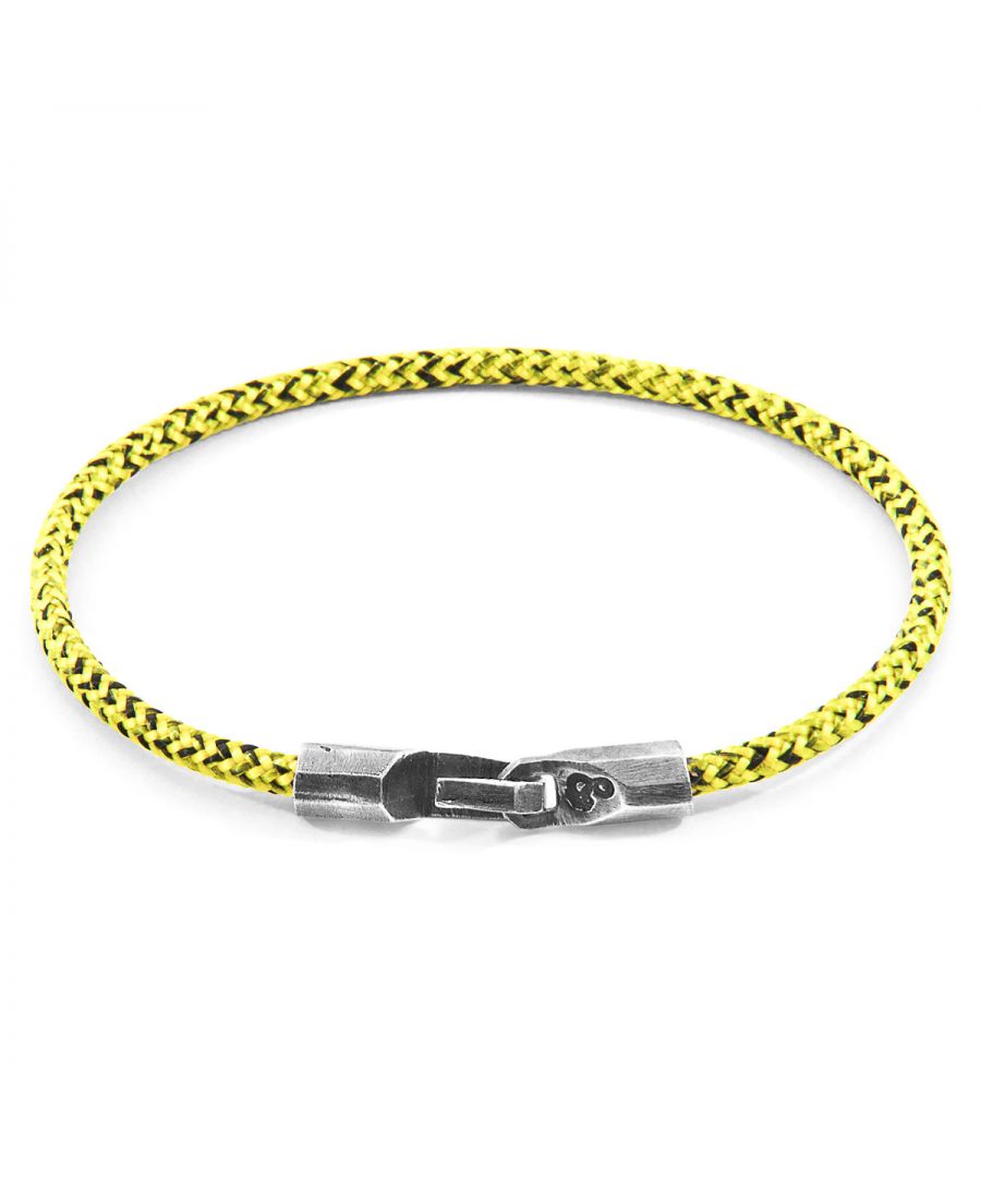 The Yellow Noir Talbot Silver and Rope Bracelet was both designed and skilfully handcrafted completely in Great Britain, In Quality We Trust. For the Modern Journeyman (and woman), ANCHOR & CREW takes ownership of an exploratory lifestyle and enjoys the Happy-Good Life. Combining British craft manufacturing with a discerning modern-minimalist style, this ANCHOR & CREW bracelet features:\n\n3mm diameter performance Marine Grade polyester and nylon rope (GB) \nSecure solid .925 sterling silver facetted barrel clasp and hook (GB)\n\nSIZING\nThis bracelet is available in four bracelet lengths, 17cm, 19cm, 21cm or 23cm in circumference. To take the bracelet on or off your wrist, simply slide the hook over the facetted barrel clasp and secure.