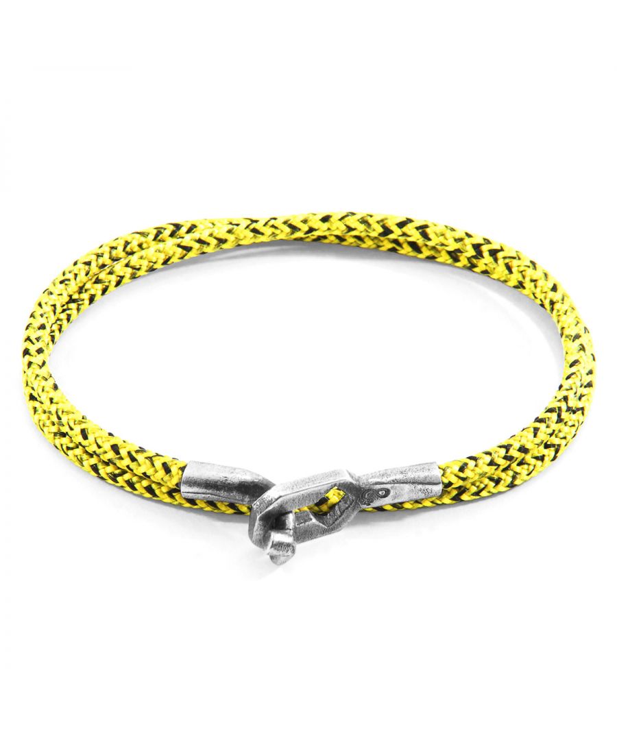 The Yellow Noir Tenby Silver and Rope Bracelet was both designed and skilfully handcrafted completely in Great Britain, In Quality We Trust. For the Modern Journeyman (and woman), ANCHOR & CREW takes ownership of an exploratory lifestyle and enjoys the Happy-Good Life. Combining British craft manufacturing with a discerning modern-minimalist style, this ANCHOR & CREW bracelet features: \n\n3mm diameter performance Marine Grade polyester and nylon rope (GB) \nSecure solid .925 sterling silver facetted keyhole clasp and key-hook (GB)\n\nSIZING\nThis bracelet is available in four bracelet lengths, 17cm, 19cm, 21cm or 23cm in circumference. To take the bracelet on or off your wrist, simply double wrap the bracelet, then align the key-hook with the hole within the clasp and secure.