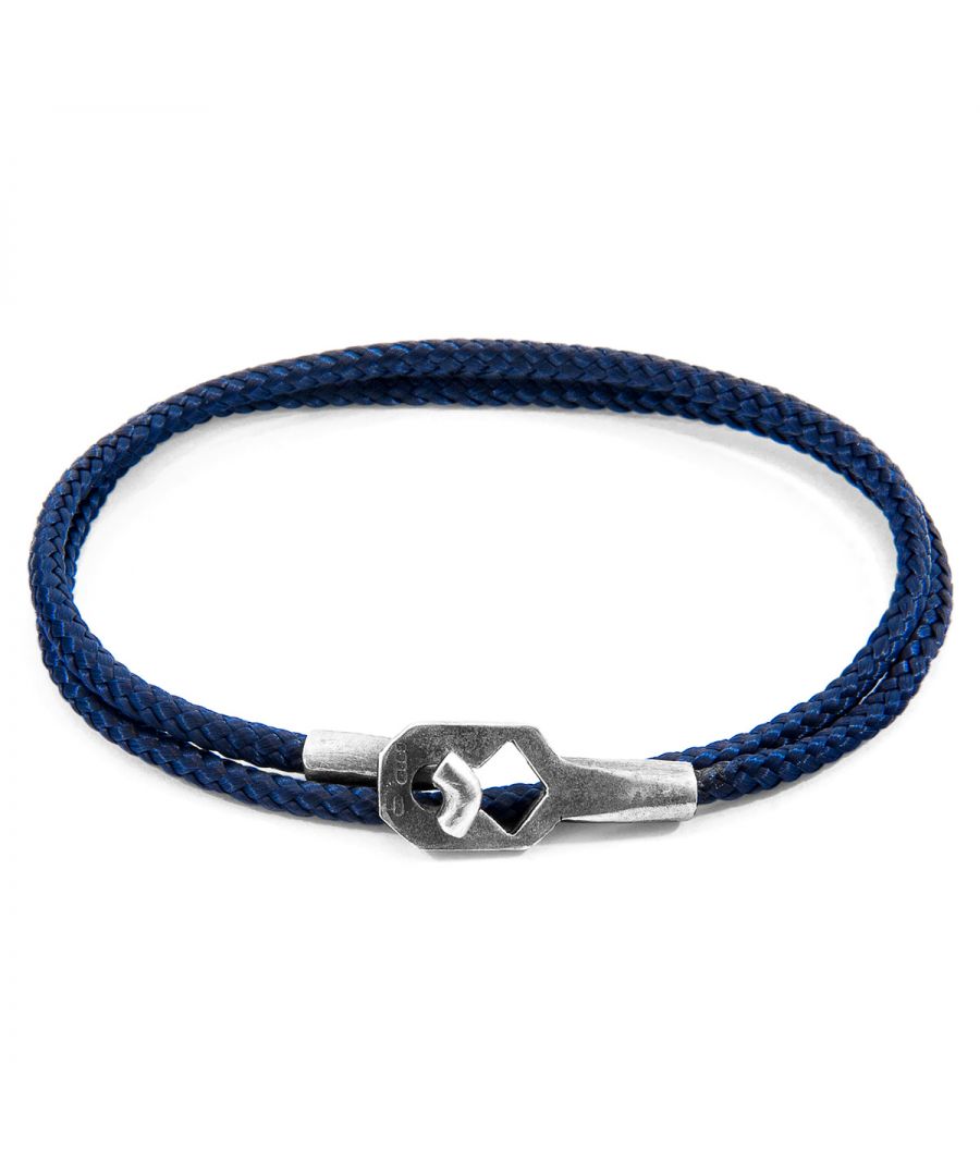 The Navy Blue Tenby Silver and Rope Bracelet was both designed and skilfully handcrafted completely in Great Britain, In Quality We Trust. For the Modern Journeyman (and woman), ANCHOR & CREW takes ownership of an exploratory lifestyle and enjoys the Happy-Good Life. Combining British craft manufacturing with a discerning modern-minimalist style, this ANCHOR & CREW bracelet features: \n\n3mm diameter performance Marine Grade polyester and nylon rope (GB) \nSecure solid .925 sterling silver facetted keyhole clasp and key-hook (GB)\n\nSIZING\nThis bracelet is available in four bracelet lengths, 17cm, 19cm, 21cm or 23cm in circumference. To take the bracelet on or off your wrist, simply double wrap the bracelet, then align the key-hook with the hole within the clasp and secure.