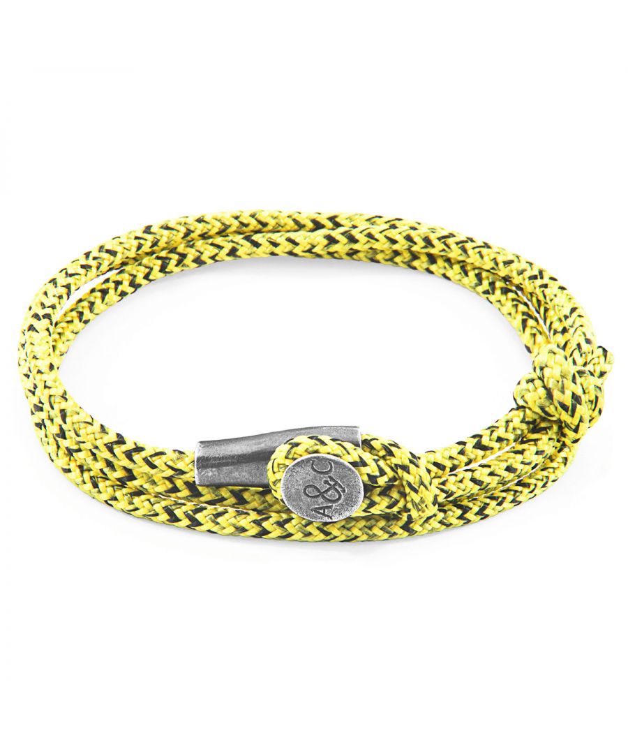 The Yellow Noir Dundee Silver and Rope Bracelet was both designed and skilfully handcrafted completely in Great Britain, In Quality We Trust. For the Modern Journeyman (and woman), ANCHOR & CREW takes ownership of an exploratory lifestyle and enjoys the Happy-Good Life. Combining British craft manufacturing with a discerning modern-minimalist style, this ANCHOR & CREW bracelet features: \n\n3mm diameter performance Marine Grade polyester and nylon rope (GB) \nSecure solid .925 sterling silver mushroom-button cleat (GB)\n\nSIZING\nThis bracelet is one size fits all, with the rope able to extend or tighten to suit your wrist size. To take the bracelet on or off your wrist, simply slide the one adjustable knot around the rope to make the loop size smaller or larger, and once set, keep the loop size consistent and continue wearing by easily unhooking the loop over the clasp. As pictured, the bracelet is most secure when the rope loop is fed through the smaller loop that emerges beyond the clasp.