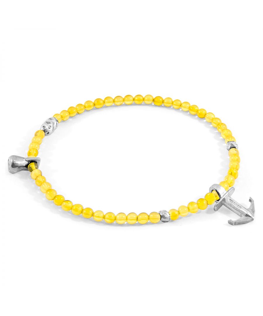 The Yellow Amber Tropic Silver and Stone Bracelet was both designed and skilfully handcrafted completely in Great Britain, In Quality We Trust. For the Modern Journeyman (and woman), ANCHOR & CREW takes ownership of an exploratory lifestyle and enjoys the Happy-Good Life. Combining British craft manufacturing with a discerning modern-minimalist style, this ANCHOR & CREW bracelet features:\n\n3mm diameter genuine yellow amber stone beads with elastic nylon thread (GB)\nSolid .925 sterling silver drop anchor, rondelles and miniature logo tag (GB)\n\nSIZING\nThis bracelet is available in four bracelet lengths, 17cm, 19cm, 21cm or 23cm in circumference, with the elastic nylon thread able to expand to fit onto your wrist. To take the bracelet on or off your wrist, simply slide the bracelet over your hand. The elastic is single-layered due to the stone's small size.