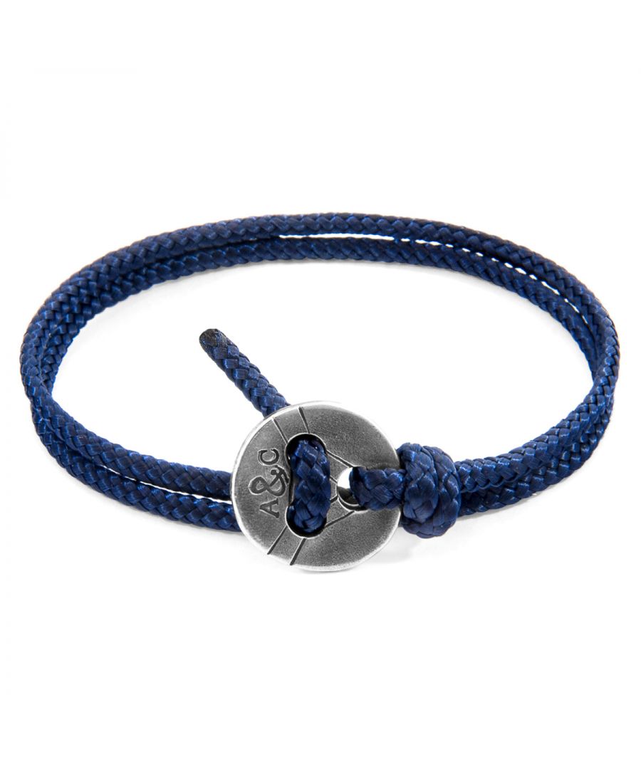The Navy Blue Lerwick Silver and Rope Bracelet was both designed and skilfully handcrafted completely in Great Britain, In Quality We Trust. For the Modern Journeyman (and woman), ANCHOR & CREW takes ownership of an exploratory lifestyle and enjoys the Happy-Good Life. Combining British craft manufacturing with a discerning modern-minimalist style, this ANCHOR & CREW bracelet features:\n\n3mm diameter performance Marine Grade polyester and nylon rope (GB) \nSolid .925 sterling silver decorated tri-hole button (GB) \n\nSIZING\nThis bracelet is one size fits all, with the rope able to suit your wrist size. To take the bracelet on or off your wrist, simply double wrap the bracelet, then feed the rope within one hole of the button and feed back through the other hole. Tighten as necessary.