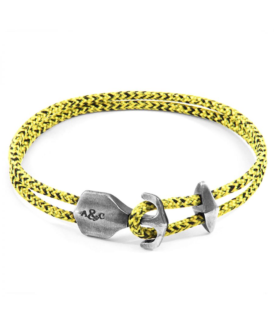 The Yellow Noir Delta Anchor Silver and Rope Bracelet was both designed and skilfully handcrafted completely in Great Britain, In Quality We Trust. For the Modern Journeyman (and woman), ANCHOR & CREW takes ownership of an exploratory lifestyle and enjoys the Happy-Good Life. Combining British craft manufacturing with a discerning modern-minimalist style, this ANCHOR & CREW bracelet features: \n\n3mm diameter performance Marine Grade polyester and nylon rope (GB) \nSecure solid .925 sterling silver anchor and rhombus clamp (GB) \n\nSIZING\nThis bracelet is available in four bracelet lengths, 17cm, 19cm, 21cm or 23cm in circumference. To take the bracelet on or off your wrist, simply (un)hook the clasp from the loop and slide the rhombus clamp for added security.