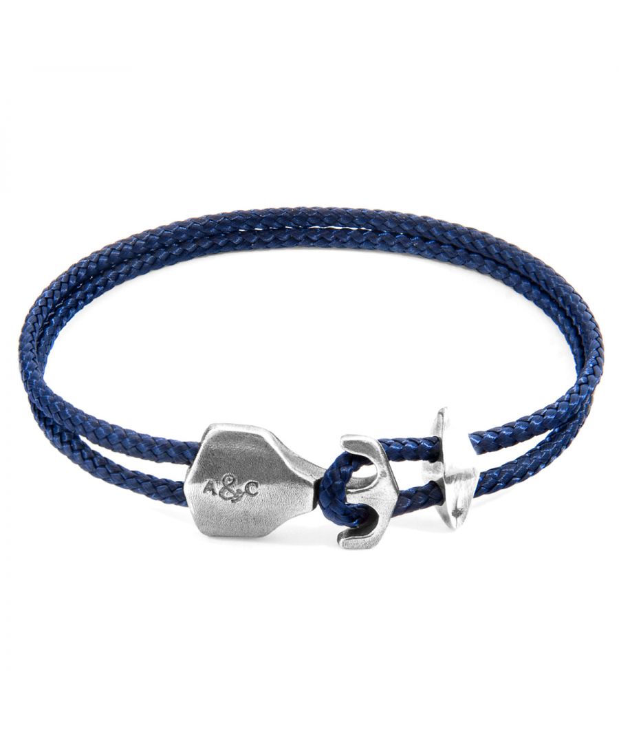 The Navy Blue Delta Anchor Silver and Rope Bracelet was both designed and skilfully handcrafted completely in Great Britain, In Quality We Trust. For the Modern Journeyman (and woman), ANCHOR & CREW takes ownership of an exploratory lifestyle and enjoys the Happy-Good Life. Combining British craft manufacturing with a discerning modern-minimalist style, this ANCHOR & CREW bracelet features:\n\n3mm diameter performance Marine Grade polyester and nylon rope (GB) \nSecure solid .925 sterling silver anchor and rhombus clamp (GB) \n\nSIZING\nThis bracelet is available in four bracelet lengths, 17cm, 19cm, 21cm or 23cm in circumference. To take the bracelet on or off your wrist, simply (un)hook the clasp from the loop and slide the rhombus clamp for added security.