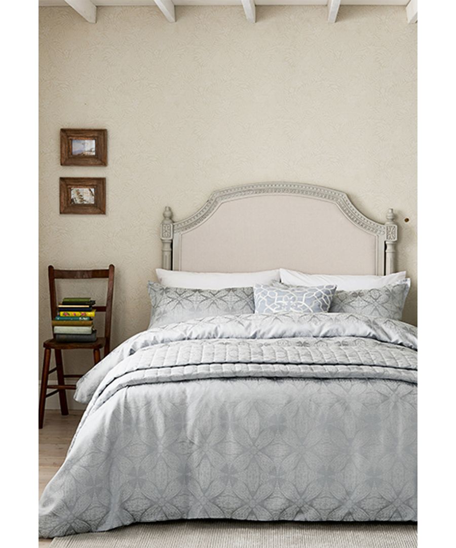 This elegant jacquard weave features a beautiful interpretation of a Sycamore leaf, combining modernity of pattern with contemporary colour. Woven in a Mist Blue colourway or a Stone alternative, the range includes four sizes of duvet cover, Oxford pillowcases and a quilted throw, each one featuring a coordinating polycotton plain dye on the reverse. A textured cotton cushion featuring an embroidered trellis pattern completes the bed. 66x72