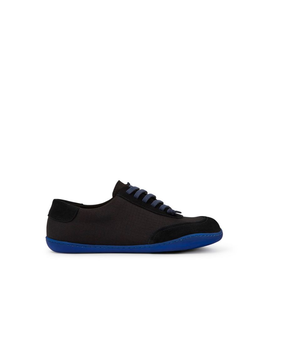 Black recycled PET and nubuck men's shoes with 100% TPU outsoles (20% recycled).\n\nA Camper Icon that evolves with every season. Peu is functional simplicity inspired by walking barefoot. It is 360-degree stitched and built with a Strobel construction technique, guaranteeing unmatched flex and durability under any conditions.
