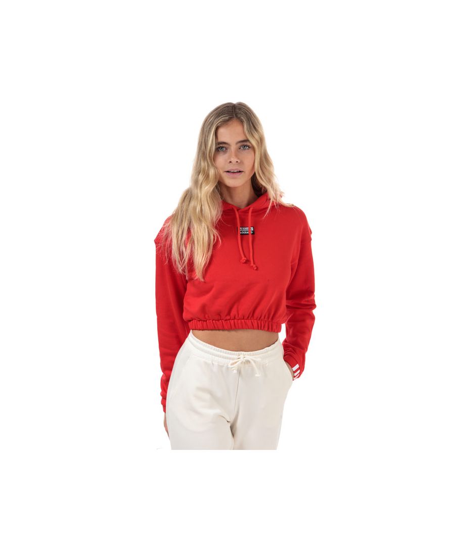 Womens adidas Originals Cropped Hoody in active red.<BR><BR>- Drawcord-adjustable hood.<BR>- Drop shoulder.<BR>- Long sleeves with applied 3-Stripes at cuffs.<BR>- Linear Trefoil logo printed at sleeves.<BR>- Woven double linear Trefoil logo to chest.<BR>- Elasticated cuffs and hem.<BR>- Regular fit.<BR>- 100% Cotton.  Machine washable. <BR>- Ref: FS6505