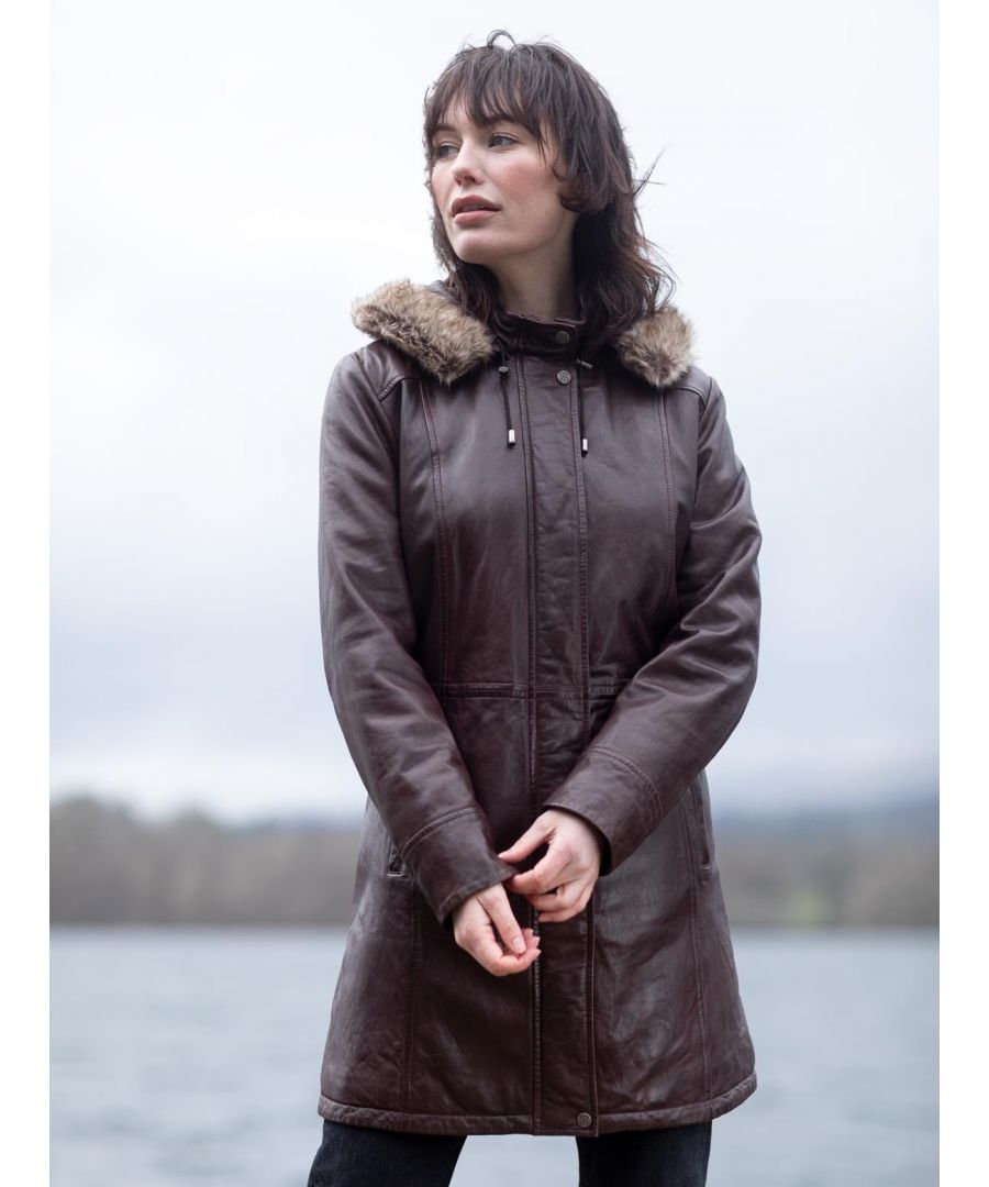 There is no better protection against the cooler months, than the Ravensworth long leather coat. Designed in soft UK sourced aniline leather as a practical coat to keep the cold at bay, we have also managed to create a stylish, flattering coat to accentuate your figure. Details include a detachable faux-fur trimmed hood, popper placket concealing a zip fastening, longline design, and a funnel collar. Stay warm this season and beyond.