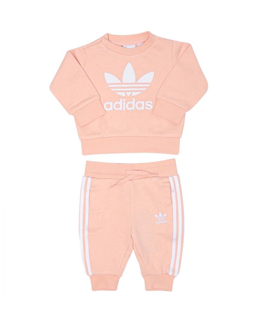 Baby adidas Originals Crew Sweatshirt Set in coral.- Sweatshirt:- Ribbed crew neck.- Long sleeves.- Hidden shoulder snaps.- Ribbed cuffs and hem.- Big contrast Trefoil logo.- Regular fit.- Main Material: 70% Cotton  30% Polyester (Recycled). Rib Part: 95% Cotton  5% Elastane.- Pants: - Drawcord on elastic waist.- Slip-in pockets.- Ribbed cuffs.- Trefoil logo printed at left thigh.- 3-Stripes.- Regular fit.- Main Material: 70% Cotton  30% Polyester (Recycled). Rib Part: 95% Cotton  5% Elastane. Lining Insert: 100% Cotton. - Ref: H35568B
