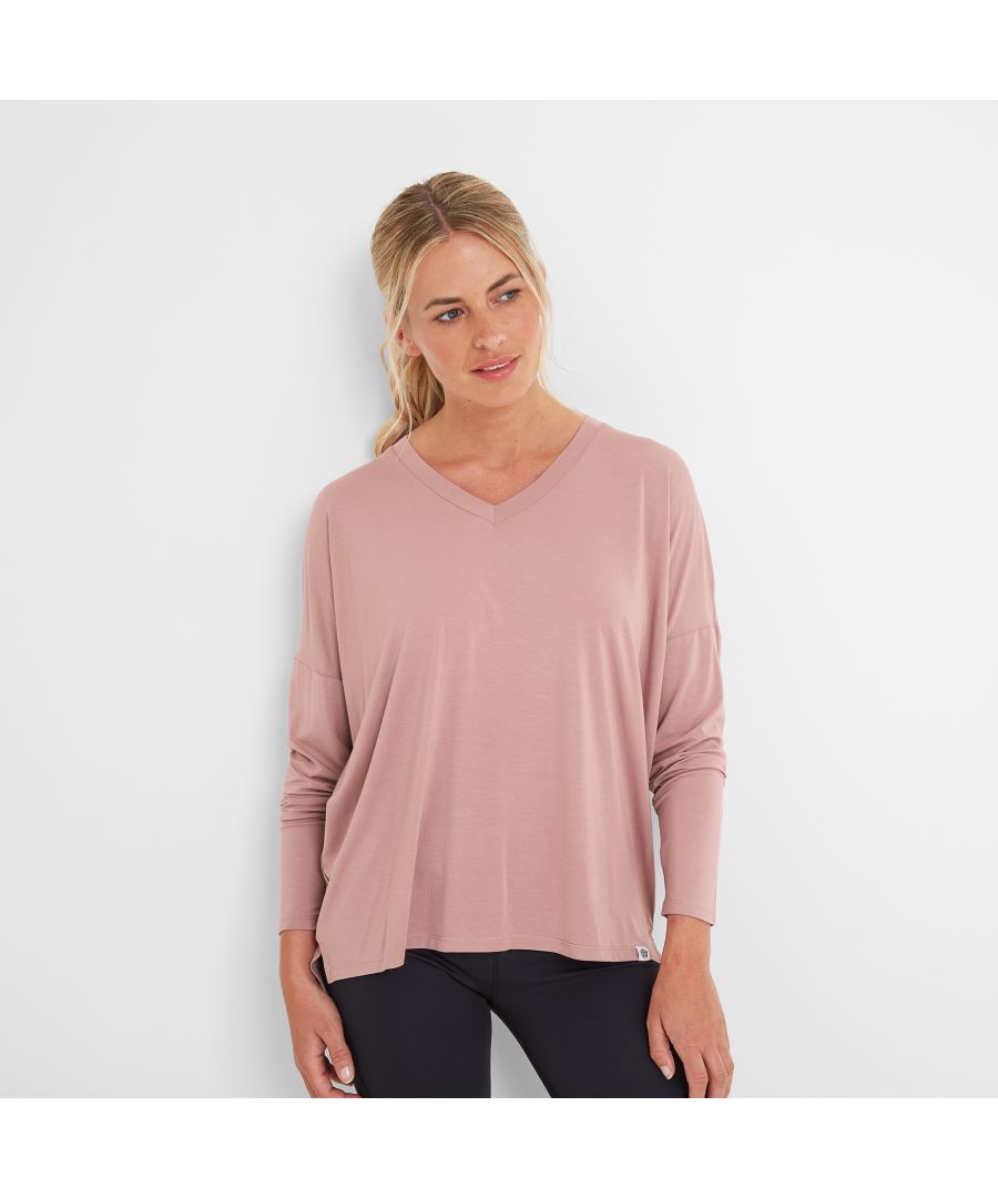 Once you slip on our Marissa Women’s super soft long sleeved Lounge Top you won’t want to take it off. It feels velvety soft, cool and slinky against the skin and has a bit of stretch so it drapes beautifully – over jeans or leggings for a day out with friends or teamed with trackies for a cosy night in. Marissa was designed by our team in West Yorkshire and comes in a fabric made with ECOVERO™ fibres that are derived from sustainable, renewable plant sources, so you’ll be doing your bit for the planet when you choose this versatile top. Design features include a soft V neck, dropped shoulders and a stepped hem with vents for flattering coverage at the back. You’ll find a discreet TOG24 woven rose label on the hem, standing for Truth Over Glory.