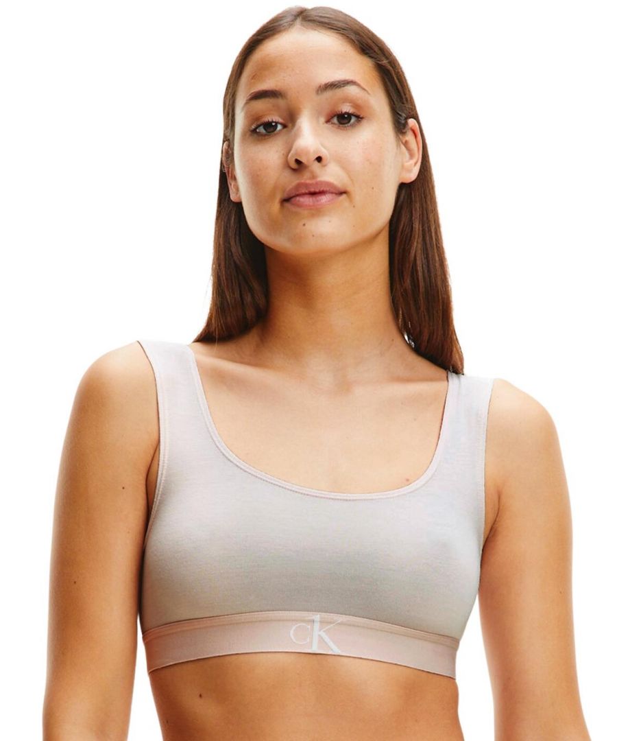 The CK One Plush collection offers a modern twist on Calvin Kleins classic athleisure style. This luxurious bralette has a CK One branded under band adding a designer look to the casual style. Non-padded for the utmost comfortable fit. For a designer relaxed style, wear with coordinating briefs from the CK One Plush collection by Calvin Klein.\n\nIconic CK One branded under band\nRounded neckline\nNon-padded and non-wired\nNon-adjustable straps\nCountry of origin: Sri Lanka\nComposition: 97% CMD | 3% Elastane\nListed in UK sizes