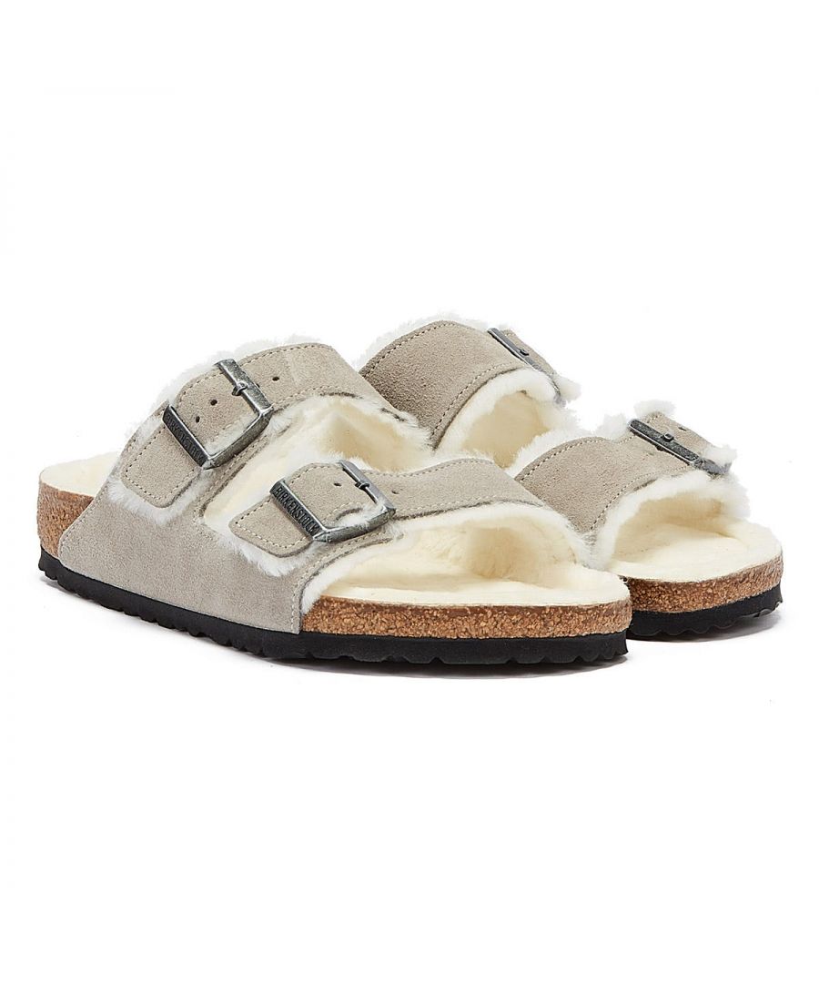 The Birkenstock Arizona is a genuine classic that has won the hearts of men and women for decades with its timeless design. This is a wonderfully comfy version of the classic model, crafted from soft suede, with a shearling-lined footbed and straps.