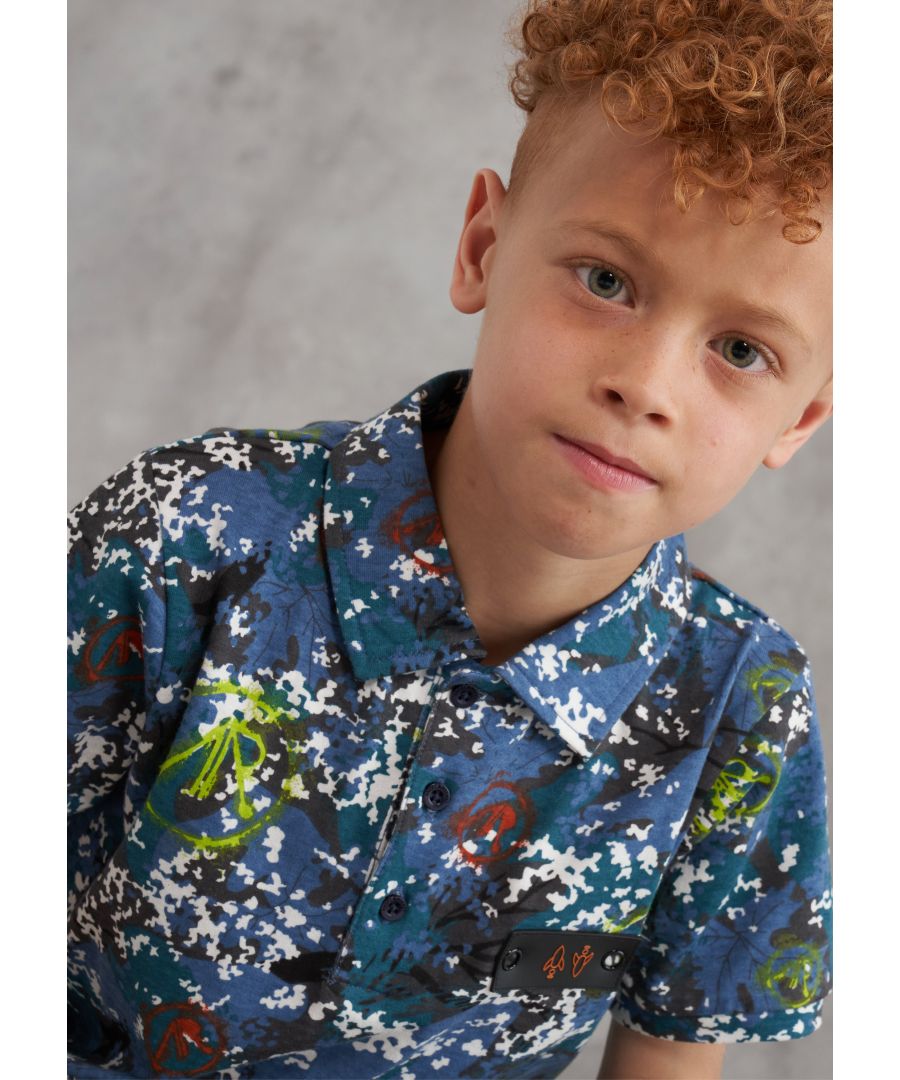 Stand out from the crowd in this pixelated camo print polo shirt. With graffiti logo overlay and branded button detail. Looking sharp!  angel & rocket cares - made with fairtrade cotton  Multi  about me: 100% cotton  Look after me: think planet  machine wash at 30c
