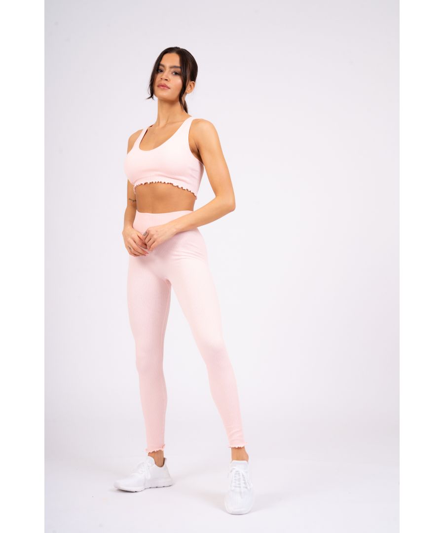 Update your wardrobe with South Beach. Cute meets comfy with this pink seamless bra. Featuring a scoop neckline, frill cropped hem in soft ribbed jersey.\n\nCoordinate with the matching leggings to complete your look!\n\n\nModel is 5ft 9 and wears size XS/S