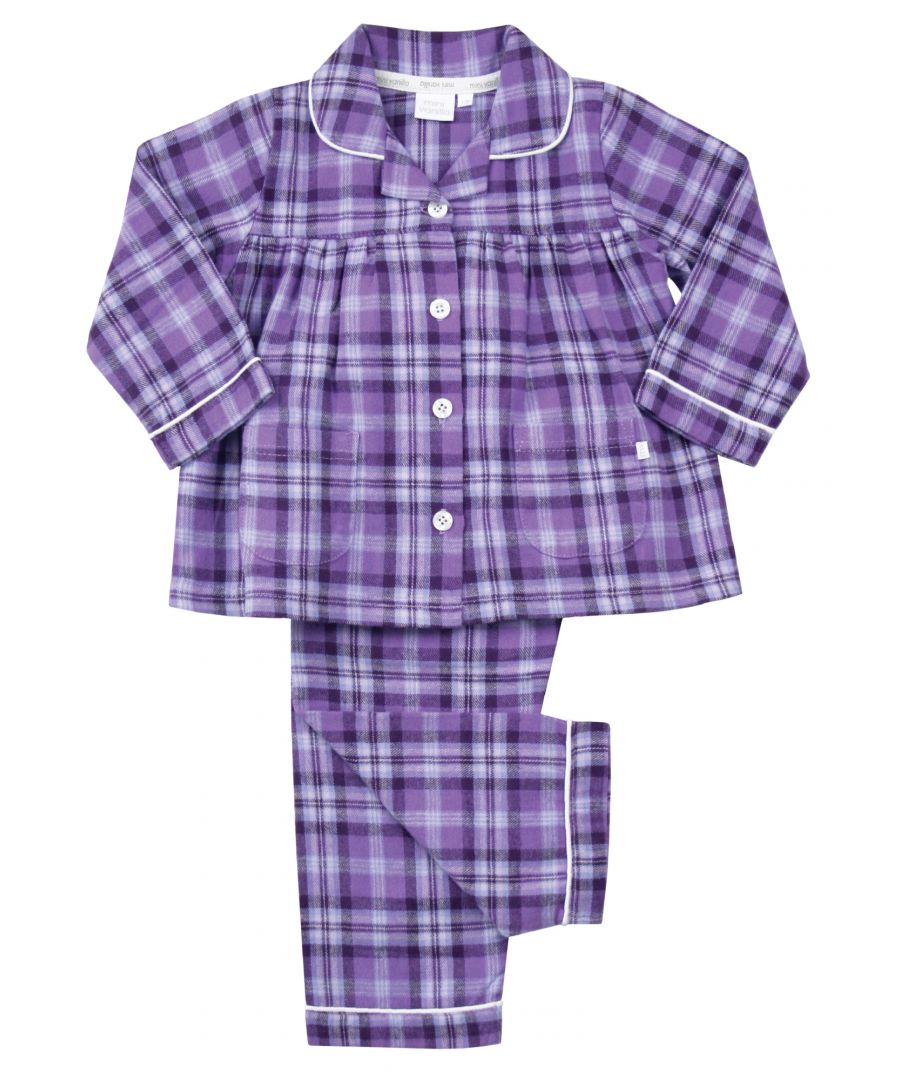 Girls Lilac and Purple Check Traditional Winter Pyjama Set. \n\nA timeless check is given the Mini Vanilla touch using lilac and purple tones in our kids pyjama set. Made from super-soft and cosy, brushed 100% cotton, the PJ set is trimmed in white cotton. The long-sleeved top has an open collar and fastens with engraved buttons. Fully elasticated at the waist the trousers have a comfy fit.\n\nOur pure-cotton check pyjamas are a beautiful-quality addition to their nightwear collection. Our cotton flannel is brushed, making it unbeatably soft and cosy against the skin and plush to the touch. A great PJ gift for girls too!\n\nFeatures\nButton-through long-sleeved top\nClassic Brushed Check Fabric\nContrast piping along collar and cuffs\nElasticated waistband\n100% soft brushed Cotton\nMachine Washable\nFront pockets\nEngraved pearl effect buttons