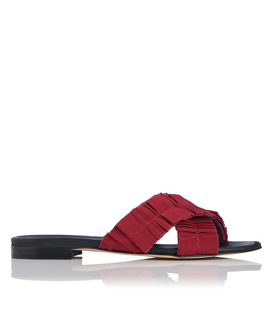 Featuring a pretty pleated grosgrain detail, these stunning Dottie sandals are a stylish suitcase essential. A classic black sole completes this sun-seeking style.