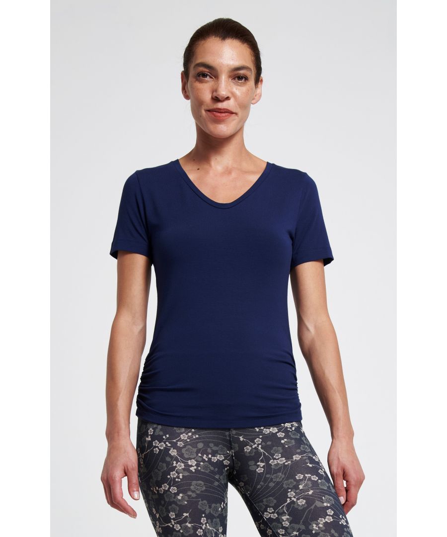 We took our bestselling Bend It Tee and added a V neckline for those of you who may prefer that shape. Same flattering side gathers at the hip and a longer length that covers the top of your bottom and thighs. This trusty tee is staying put in even the most advanced yoga or Pilates pose.\n\nMade with 95% Bamboo Viscose, 5% Elastane\nUnrivalled softness and great for sensitive skin\nNaturally sweat-wicking and breathable\nFrom sustainably managed forests\nOeko-Tex certified no nasties in the dyeing process