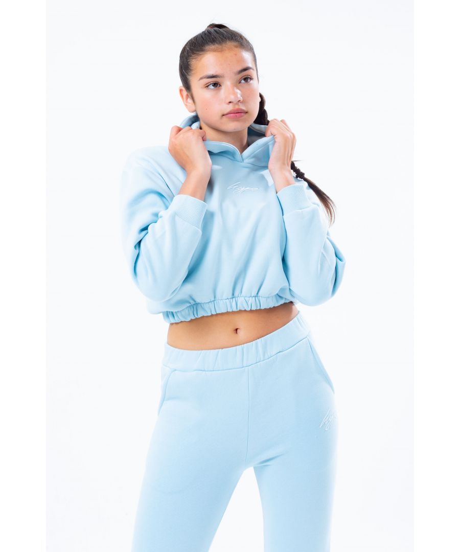 The cutest crop hoodie you'll need this season, and every season after that. The HYPE. Pale Blue Elasticated Waist Kids Crop Pullover Hoodie. The fabric boasts a 80% Cotton and 20% Polyester fabric base for the upmost comfort. With a fixed hood and fitted hem and cuffs finished with the iconic HYPE. script logo embroidered in a tonal blue across the front. Wear with cycle shorts to stay on trend this season. Machine wash at 30 degrees.