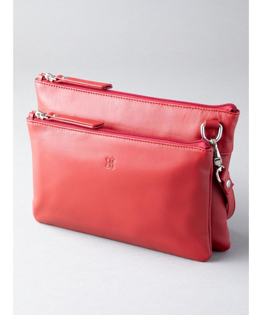 Why have one bag when you can have two, with the Tally Duo Leather Cross Body Bag in Red. The Tally Duo offers two in one, a bag compact but big enough for everything you could need.  With one small bag attached to the larger base bag, organising your belongings is simple. Additionally, you have the option to remove the adjustable strap and carry as a fanciful clutch. The women's leather Tally Duo is an accessory that has all bases covered.
