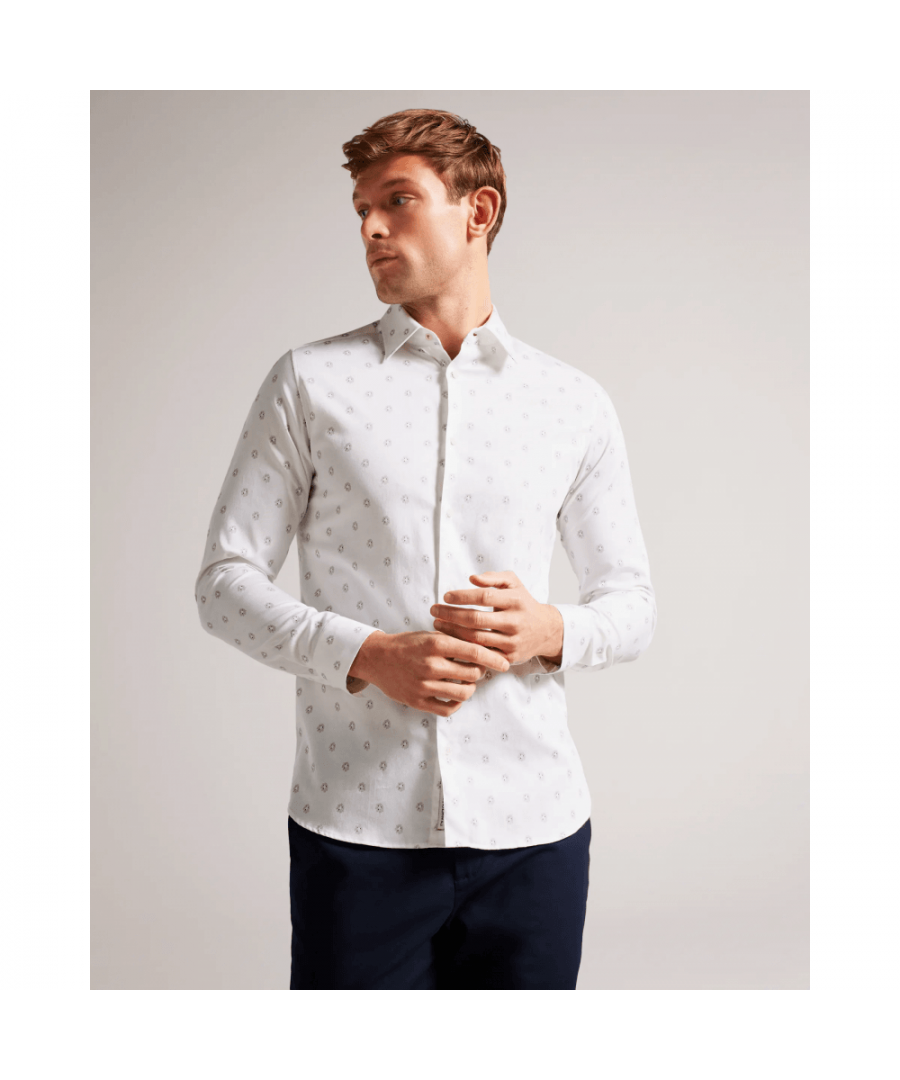 Bring the beauty of a flower garden to your wardrobe with our KYME button-up shirt. Made from a comfortable cotton blend, this long-sleeved shirt features a classic collar and a regular fit for a timeless look. Whether paired with jeans for a casual day out or tucked into dress pants for a more formal occasion, this shirt is sure to make a statement.\nButton up shirt. Cotton blend. Painted floral print. Long sleeved. Classic collar. Regular fit.\n97% Cotton, 3% Elastane.