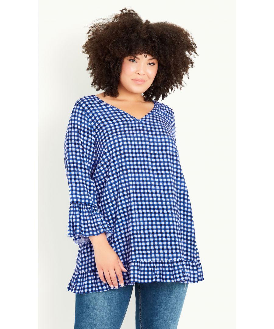 Style an effortlessly chic look with our blue gingham Gem Ruffle Tunic. This top has a relaxed fit for easy dressing, alongside ruffle trim sleeves and a V-neckline. Key Features Include: - V-neckline - 3/4 length sleeves with ruffle trims - Relaxed fit - Ruffle trim - Non-stretch woven fabrication