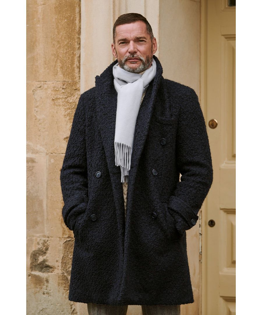 We really rate bouclÃ© weaves for bringing a bit of texture to an everyday look.Moss' wool-blend navy overcoat is a great way to make the fabric work for you, with a double-breasted front, cuff straps and side pockets making it an unbeatable layer over casual and formal outfits throughout the week.
