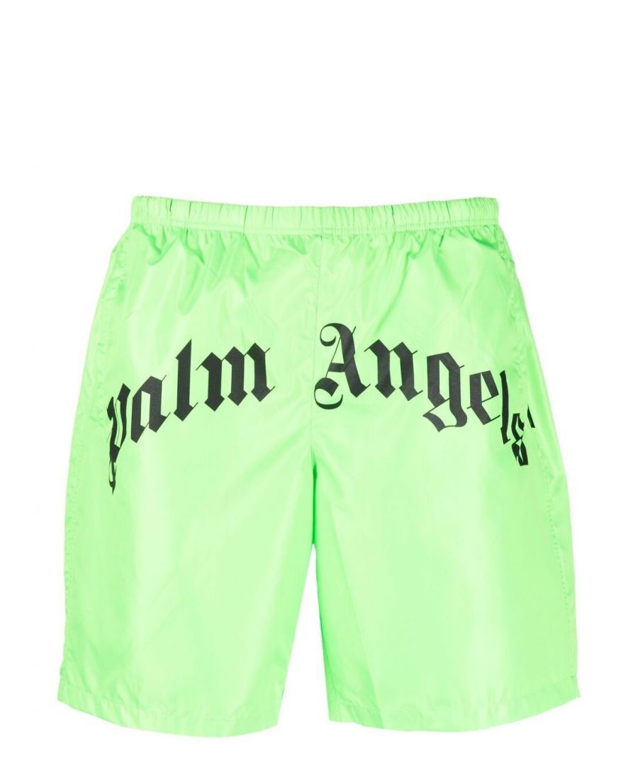 These fluorescent green swim shorts from Palm Angels are made instantly recognisable by a contrasting logo print to the front of the design, evoking the brand's signature street-style aesthetic.\n\n\n\nfluorescent green/black\nlogo print to the front\nmini logo tag\nelasticated waistband\ntwo side slit pockets\nrear welt pocket\n\n\n\nPlease note this product has had the Certilogo labels removed at source. Find more information on our Authenticity Guarantee page. 