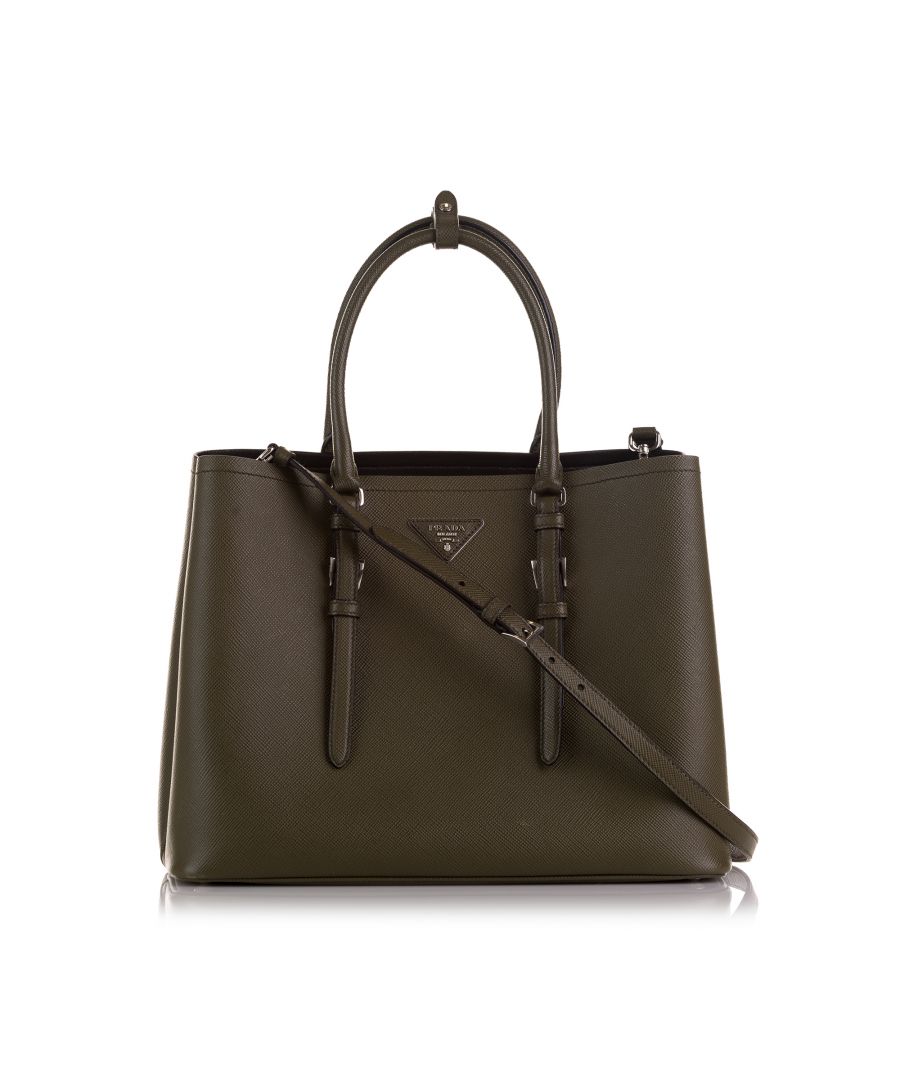VINTAGE. RRP AS NEW. The Double Cuir Tote features a saffiano leather body, rolled leather handles, a detachable flat strap, interior pockets, and an open top.Exterior Front stained with Other. Exterior Back stained with Other. Exterior Corners Scratched, Worn. \n\nDimensions:\nLength 27cm\nWidth 35cm\nDepth 17cm\nHand Drop 16cm\nShoulder Drop 60cm\n\nOriginal Accessories: Dust Bag\n\nSerial Number: 180A\nColor: Brown\nMaterial: Leather x Calf\nCountry of Origin: Italy\nBoutique Reference: SSU201110K1342\n\n\nProduct Rating: GoodCondition\n\nCertificate of Authenticity is available upon request with no extra fee required. Please contact our customer service team.