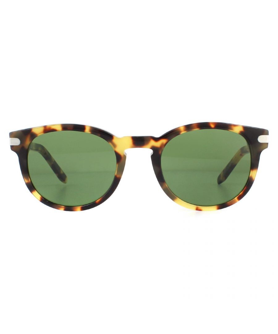 Salvatore Ferragamo Sunglasses SF935S 214 Tortoise Green have a chunky acetate frame with rounded lenses and a keyhole bridge. Temples feature a metal plaque engraved with the Ferragamo logo.