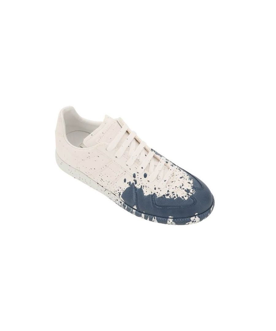 Replica sneakers by Maison Margiela crafted in cotton canvas and characterized by the contrasting paint spot on the toe. Lace-up closure, debossed logo on the tongue and iconic white stitch on the back. Fabric and leather lining, removable leather insole, rubber sole. Every item is unique due to its manual refinement.