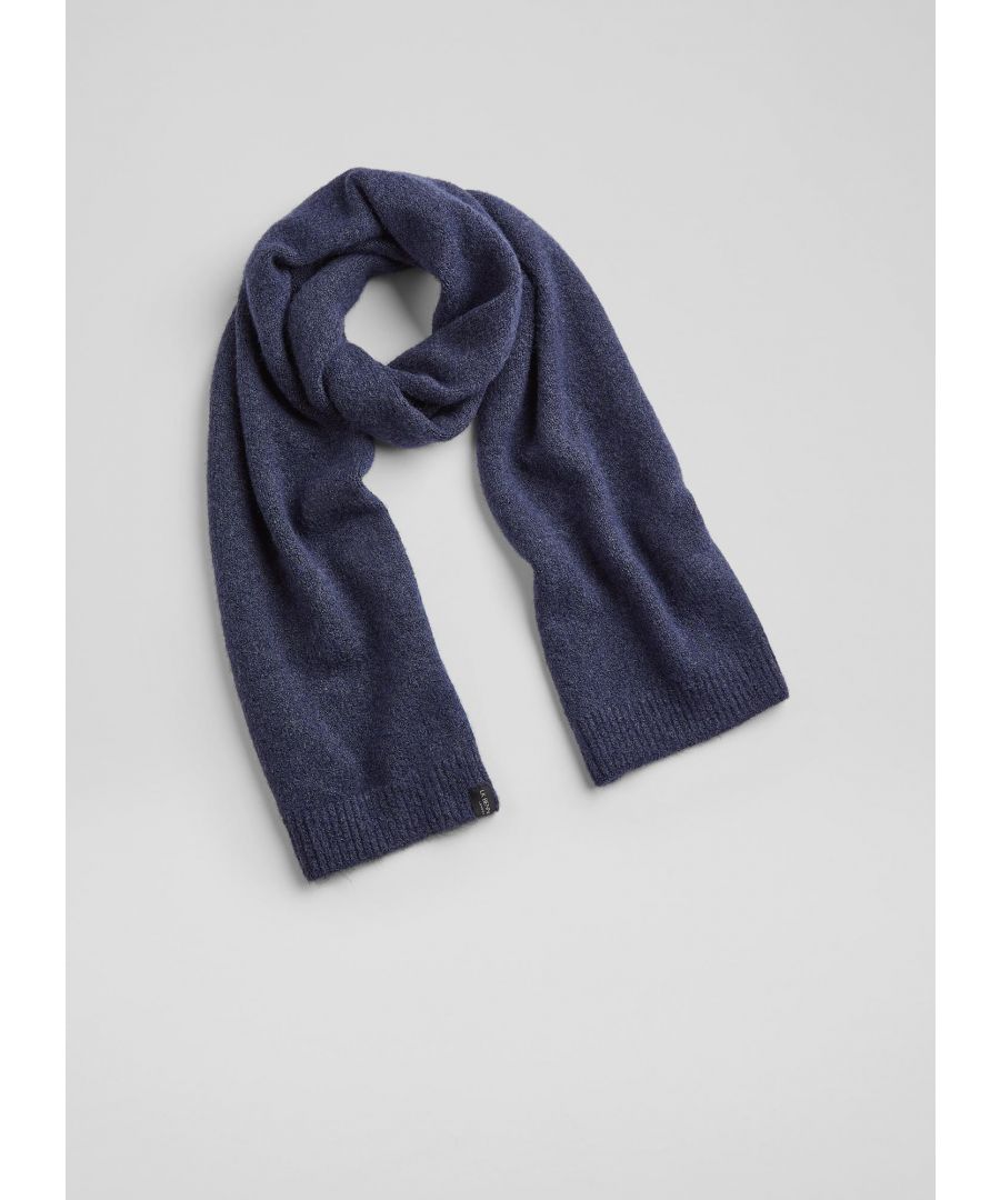 A simple knitted scarf is the perfect accessory when winter temperatures start to bite, and our Lisa scarf works brilliantly by itself or with the matching pieces for extra cosiness. Incredibly soft and warm in a classic navy blue marl, it's a long, plain knit style with ribbed ends and a subtle LKB label. Wear it with the Dalston hat and Molly gloves for a chic, cosy set.