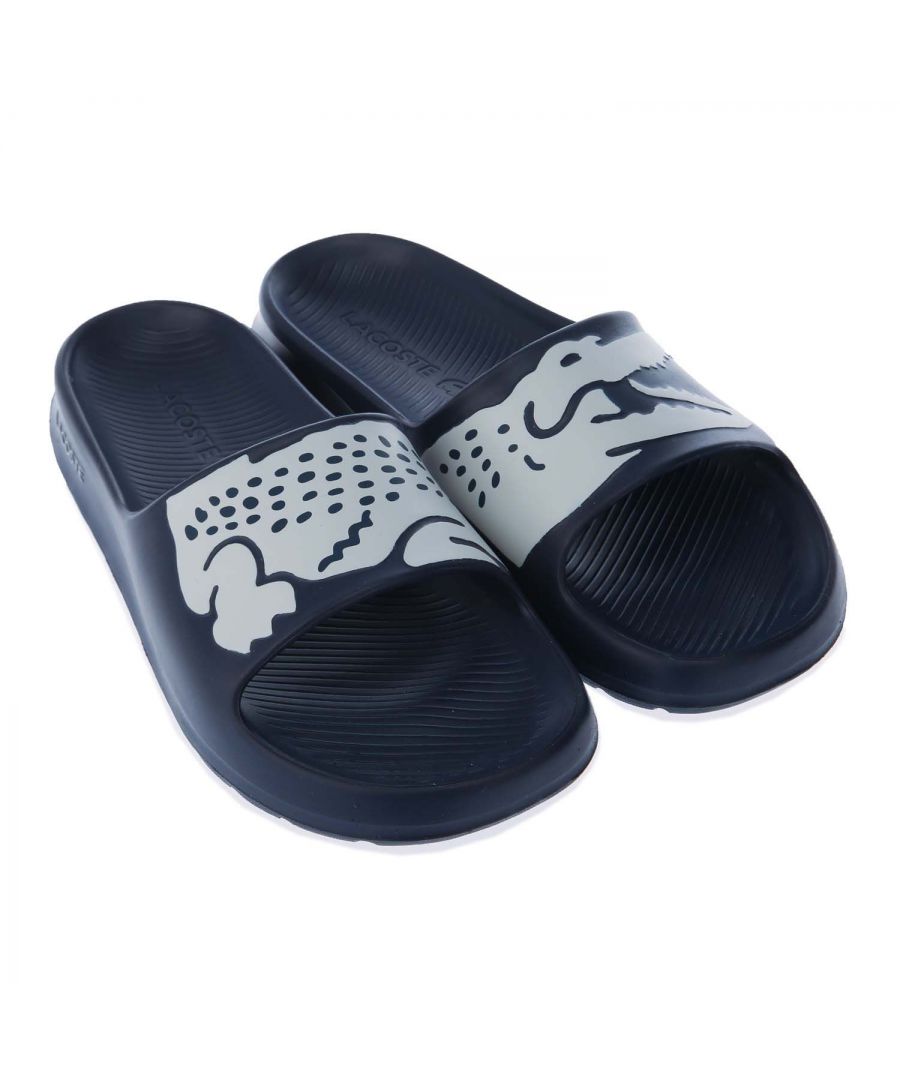 Womens Lacoste Croco Slide Sandals in navy- white.- Synthetic upper.- Slip on closure.- Contrast crocodile printed across the straps.- OrthoLite insole.- Water-resistant uppers.- Injection moulded EVA outsole- Synthetic upper  Synthetic lining and sole.- Ref.: 741CFA0035092