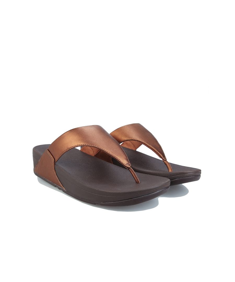 Womens FitFlop Lulu Leather Toe Thong Flip Flops in bronze.Biomechanically engineered  comfortable wedge sandals.- Metallic leather upper.- Slip-on toe post construction. - Comfortable  lightly padded microfibre-lined upper.- Microwobbleboard midsole - absorbs shock  diffuses pressure and provides extraordinary comfort.- Built-in arch contour.- Embossed FitFlop branding to footbed.- Standard Microwobbleboard midsole provides a slightly narrow yet generous fit.  Perfect for average feet that like a looser fit.- Wedge height 1.75“ - 4.5cm approximately.- Leather upper  Textile and synthetic lining  Synthetic sole.- Ref: I88-012Measurements are intended for guidance only.