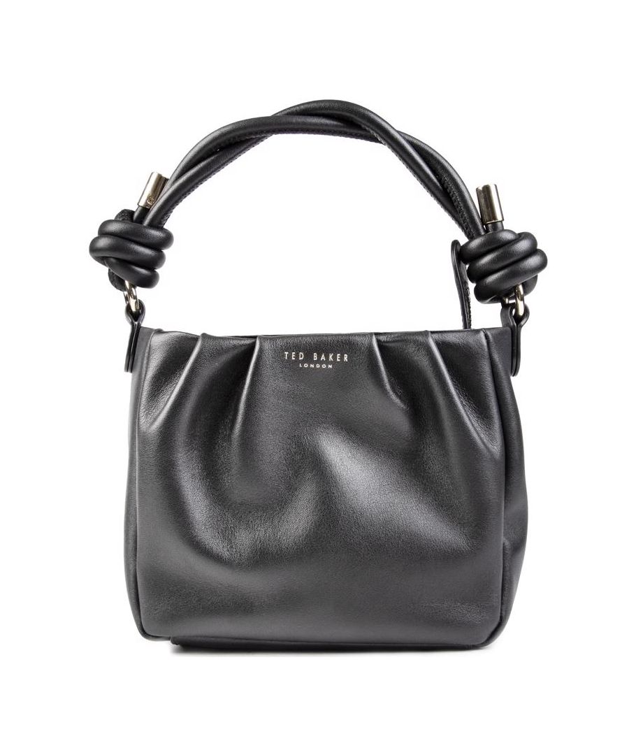 Womens black Ted Baker twili handbag, manufactured with leather. Featuring: single top handle, top zip closure, gold hardware, detachable shoulder strap and protective dustbag.