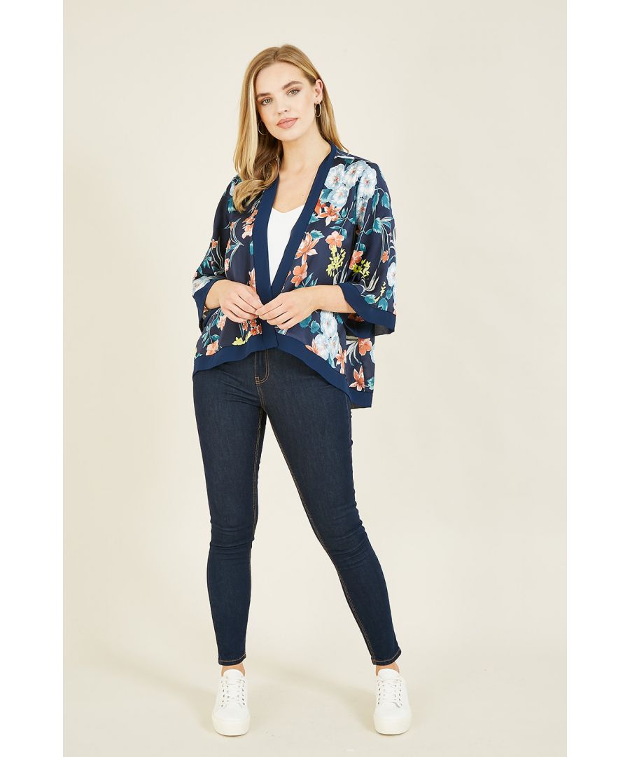 New season silkiness is here - in the form of a gorgeous violet printed, short navy kimono. Perfect matched with jeans or paired with a lacy crop and heels, this piece can be repurposed from day to evening wear in a flash.