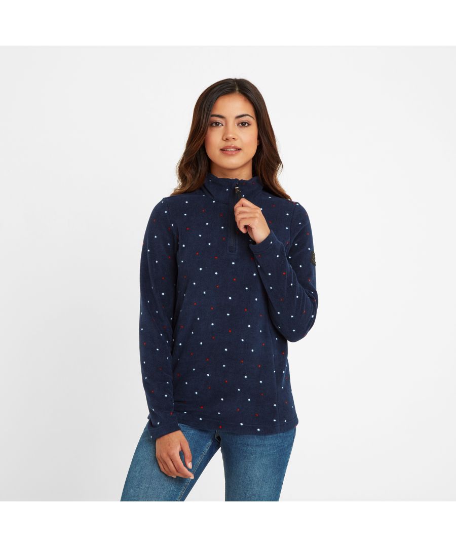 Supersoft, lightweight, warm and cosy, our Shepley microfleece is ideal to team with jeans for a brisk walk across the Yorkshire moors, or to wear as a mid-layer over gym clothes and under a coat when it turns colder. Shepley comes in a fun, all over, irregularly spaced polka dot design, which is printed into the pile so it won't wash out, and this lifts it out of the ordinary. The fabric is anti-pill, meaning that it has been treated to prevent little bobbles building up on the surface. This zip neck fleece is lightly brushed on the inside for a fluffed up feeling that's cosy and soft, so it feels great on too. The finishing touch is our embossed rubber TOG24 badge on the sleeve.