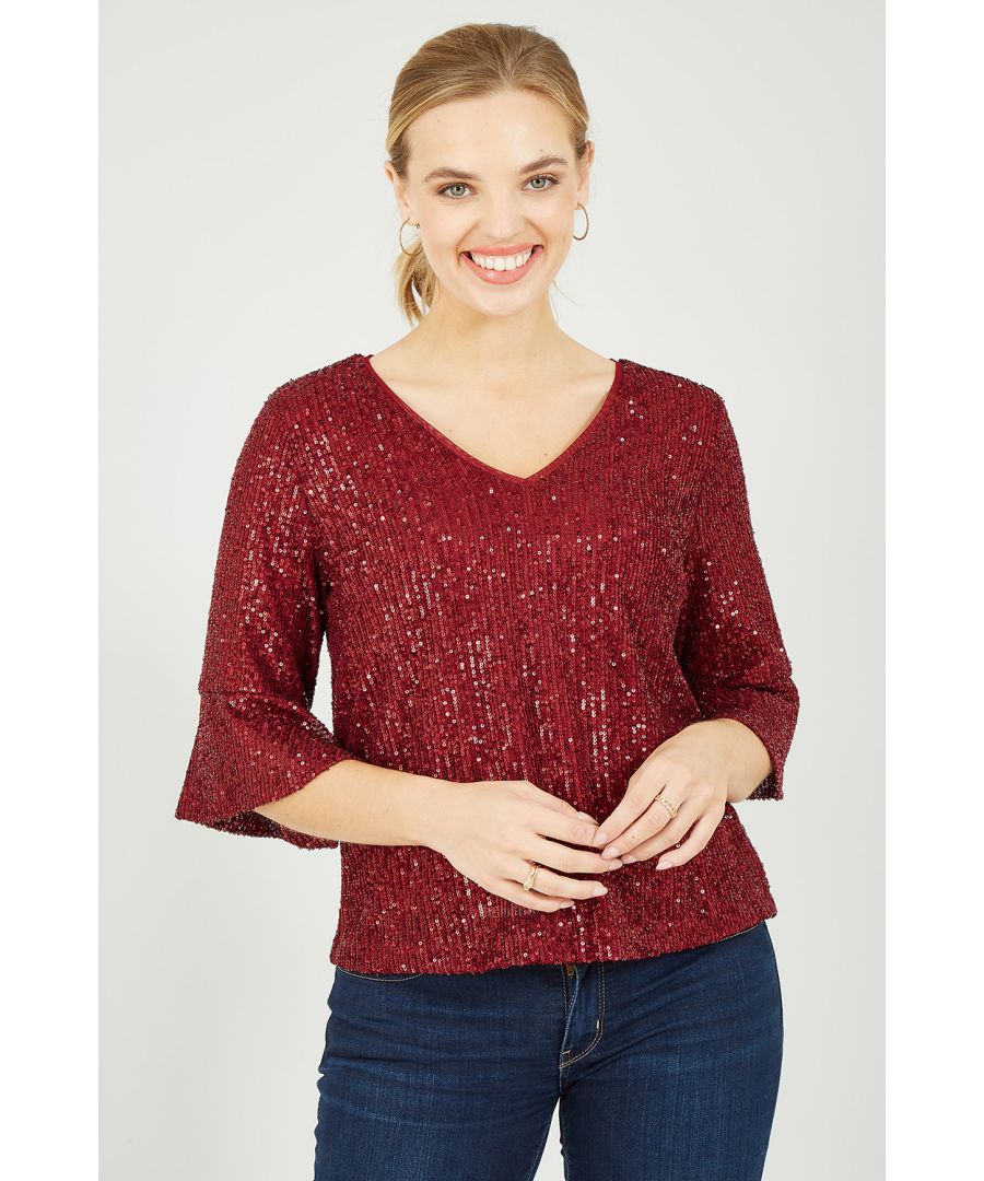 Out out has never felt so good! This stunning Yumi Red Sequin Relaxed Fit Top is super stylish and perfect for parties. With all-over, navy sequin detailing, this relaxed fit top is fully lined, fusing comfort with style. Features super flattering fluted sleeves and a peep hole back fastening. Match with skinny black jeans or leather trousers to complete the look.
