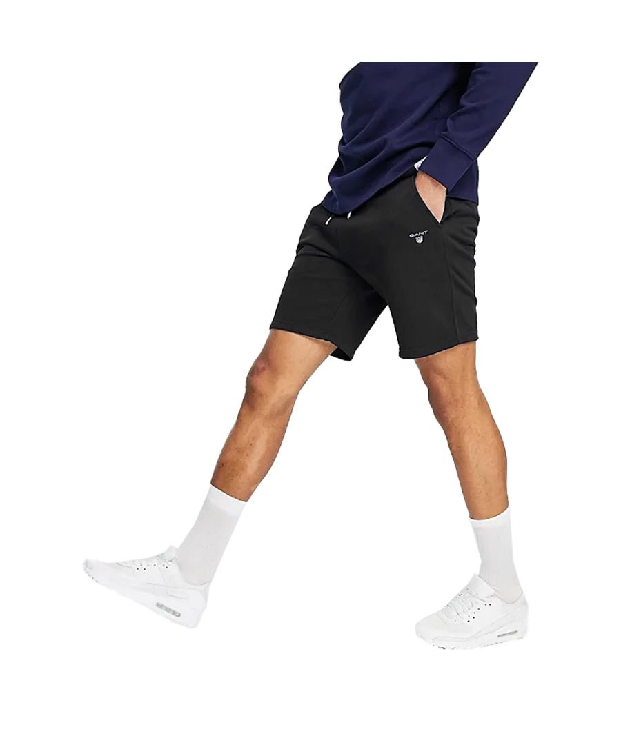 Great-value, GANT Sweat shorts in black. 87% Cotton,13% Polyester. Featuring a stretch waistband with external rope ties with Gant-inscribed metal ends, two front side slash pockets, For Casual, Gym and Travel Occasions.