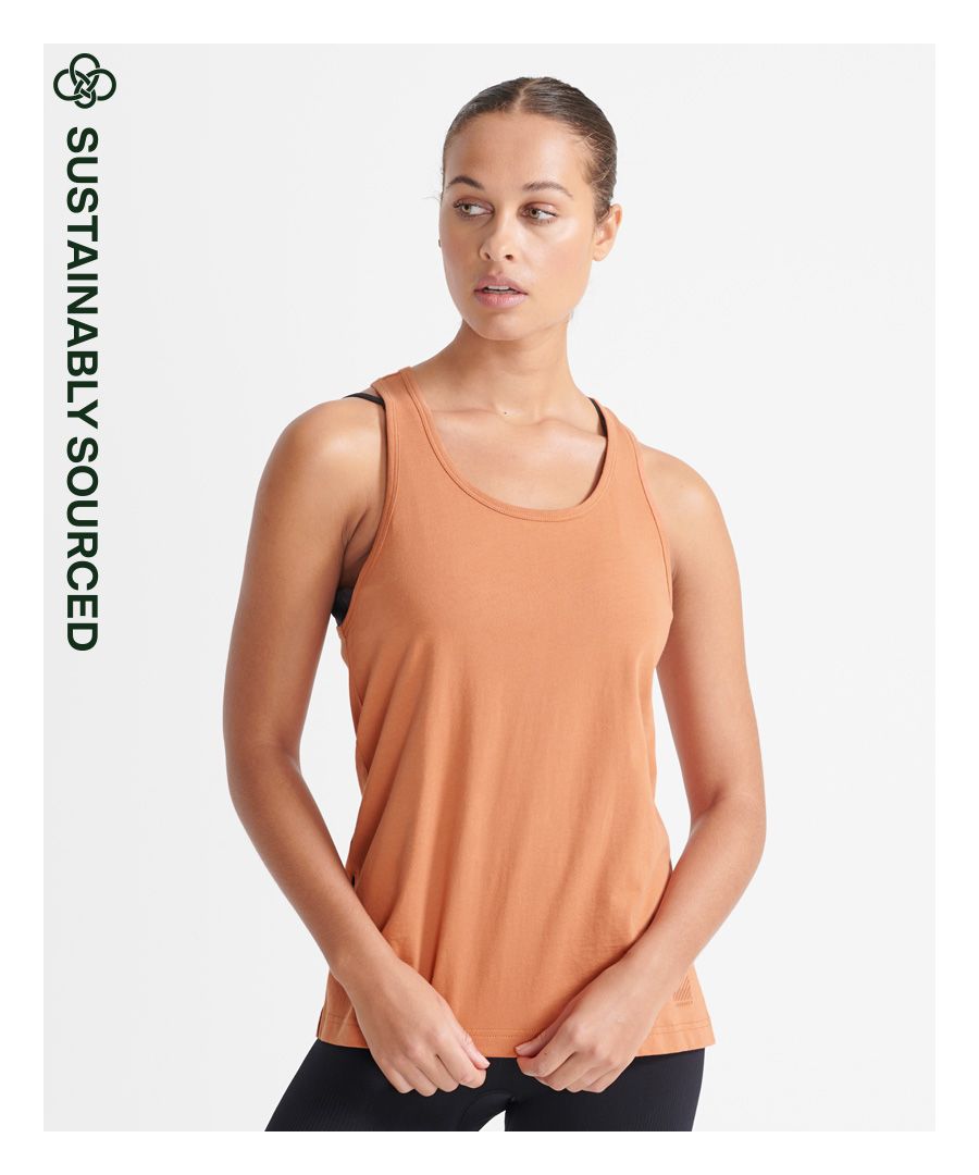Looking for a comfortable top that will stretch with you as you practice your best yoga pose, or warm-up for a dance? The Flex Organic Cotton Tank Top has got you covered.Relaxed: A classic fit. Not too slim, not too tight – no distractions hereCrew necklineCrossover backMinimalist brandingMade with Organic Cotton - which is grown without the use of artificial chemicals, leading to better soil, 60-90% less water used, and better health for farmers.
