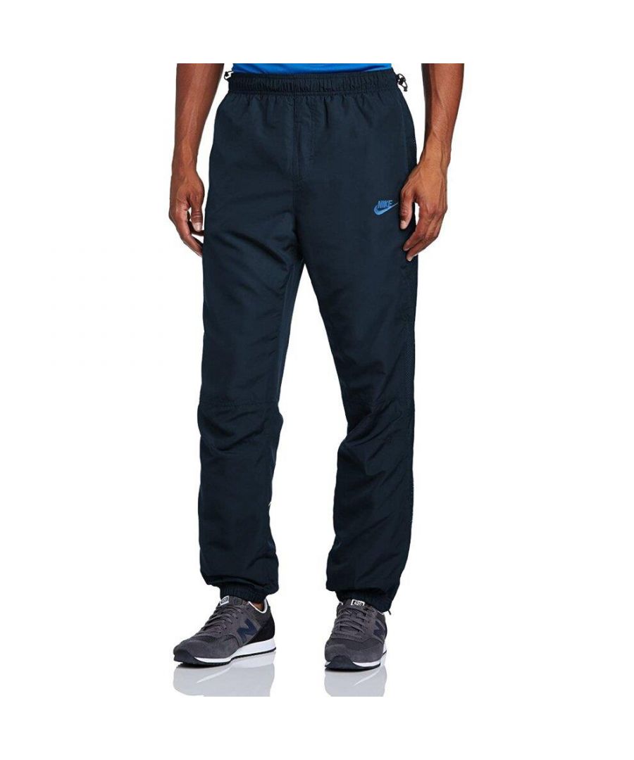 Nike Mens Light Weight Woven Track Pants.  \nThey've Got an Elastic Waistband With Drawstring Closure on Both Sides of the Waist for Ultimate Comfort Support.  \n2 Hand Pockets,  Additional Secured Zip Pocket on the Left Leg.   \nElastic Waistband at the Ankles With Zip Closure Details Going Down Both Sides.   \nPerforated Stripes and a Breathable Mesh Lining for Comfort.  \nOther Details Include a Contrast Nike Swoosh and Logo Embroidery on Left Thigh.  \nLarge Contrast Nike Wordmark on Back of Lower Right Leg.  \nLogo and Nike Tab Red Stitching on Back of Upper Right Leg.\nIdeal for Training and Daily Activities.