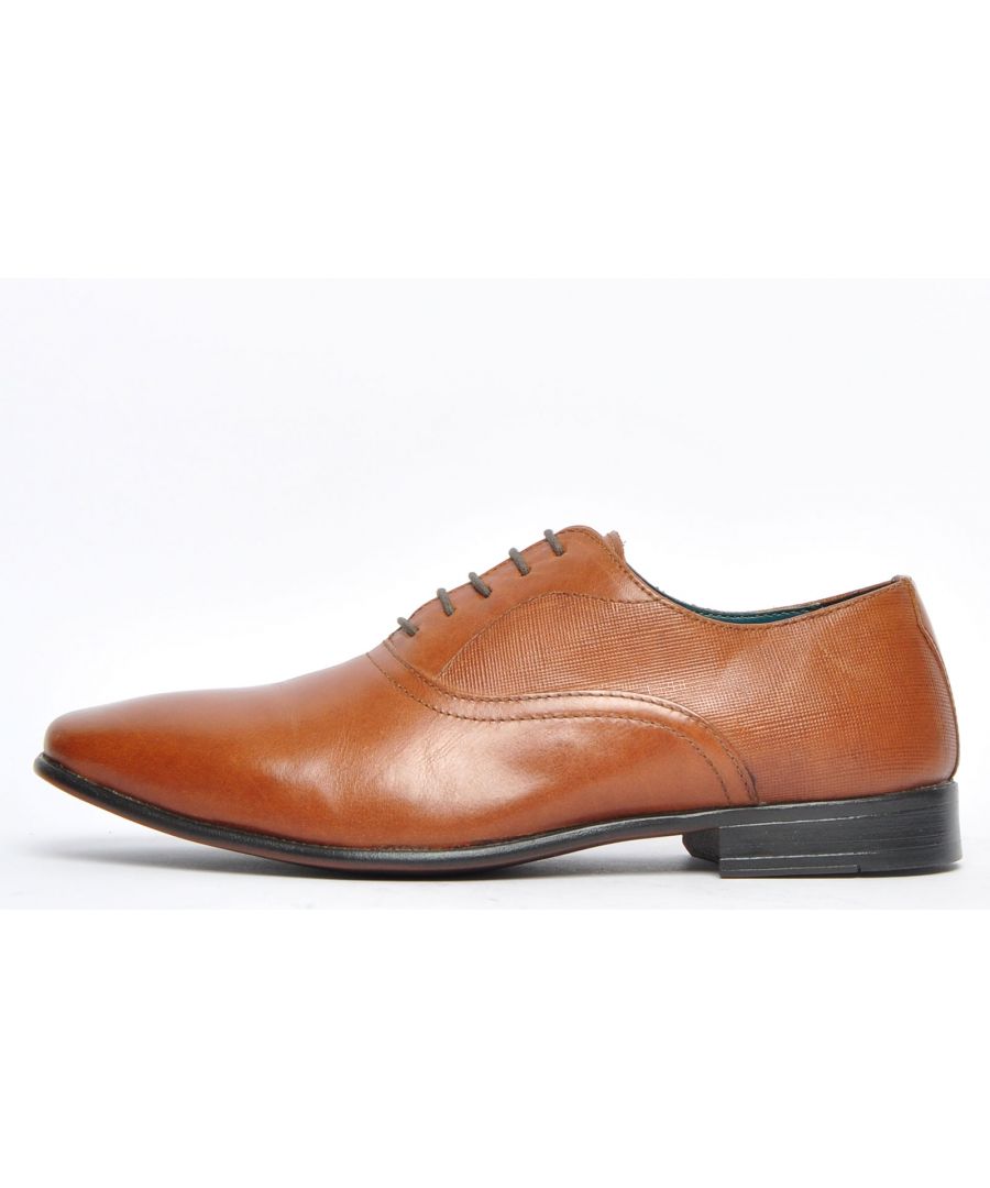This Red Tape Leather Banks lace up shoe boasts classic Oxford style with a premium leather upper offering a standout shoe with luxurious executive looks, setting the trend for formal wear whilst maintaining a casual edge. The Banks can be dressed up or down, be casual or formal and can be worn with jeans or a pair dress trousers. The slimline sole delivers on trend styling whilst the grippy sole delivers secure wear wherever you go. Premium looks in the form of a lightly patterned saddle to the upper sit right at the forefront of this high-end leather lace-up shoe, so youre guaranteed super comfy wear all day every day. The combination of style and practicality make the Banks ideal for all occasions and all at a price which wont hurt your pocket!\n - Classic Oxford styling\n - High quality leather construction\n - 4 hole lace up system\n - Slimline designer styled sole unit\n - Comfy inner\n - Designer stitch detailing\n - Durable grippy rubber outsole\n - Red Tape branding