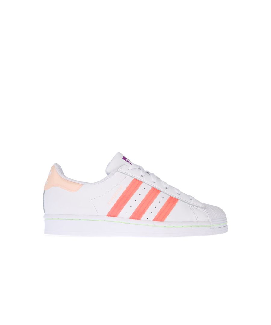 Womens adidas Originals Superstar Trainers in white pink.- Premium leather upper.- Lace up closure.- Round Toe.- Moulded sockliner.- Tonal 3-Stripes to sides and printed ‘Superstar’ wordmark.- Rubber sole.- Leather upper  Textile lining  Synthetic sole.- Ref: FW2502