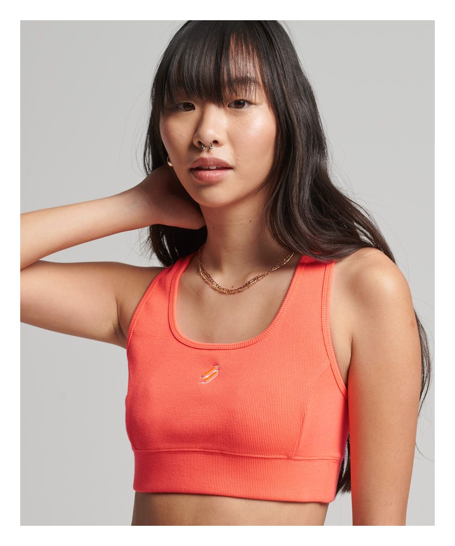 When it comes to activewear, we get that it can be difficult to keep personal style when trying to bring a sporty touch to your wardrobe. This crop top is our solution, featuring a comfortable elasticated design that ensures you’ll be able to move and feel comfortable. It’s finished off with a distinct colour range and the iconic Code logo to truly give you an athletic chic.Fitted: A body sculpting fit, tight to the bodyScoop neckSleeveless designRibbed trimsElasticated hemEmbroidered Code logo